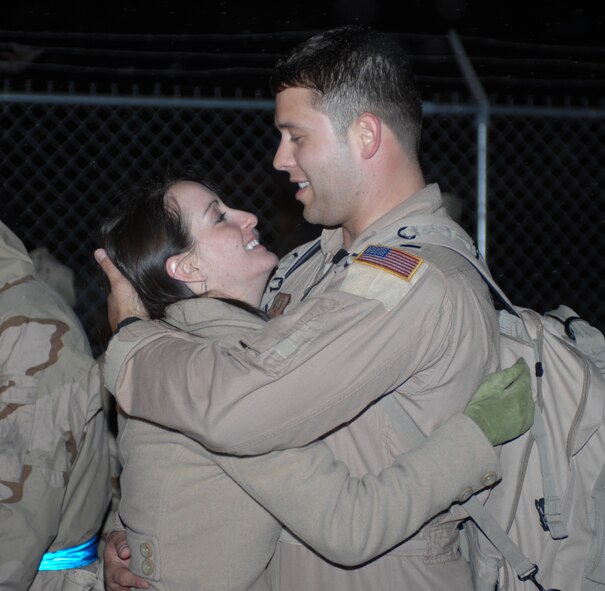 1st Lt. Philip Domke from the 39th Airlift Squadron is welcomed with open arms as he returns home from an overseas deployment. The Airmen traveled to numerous countries and did cargo drops and convoys to help support the Global War on Terror. (U.S. Air Force photo by Airman Jennifer Romig)