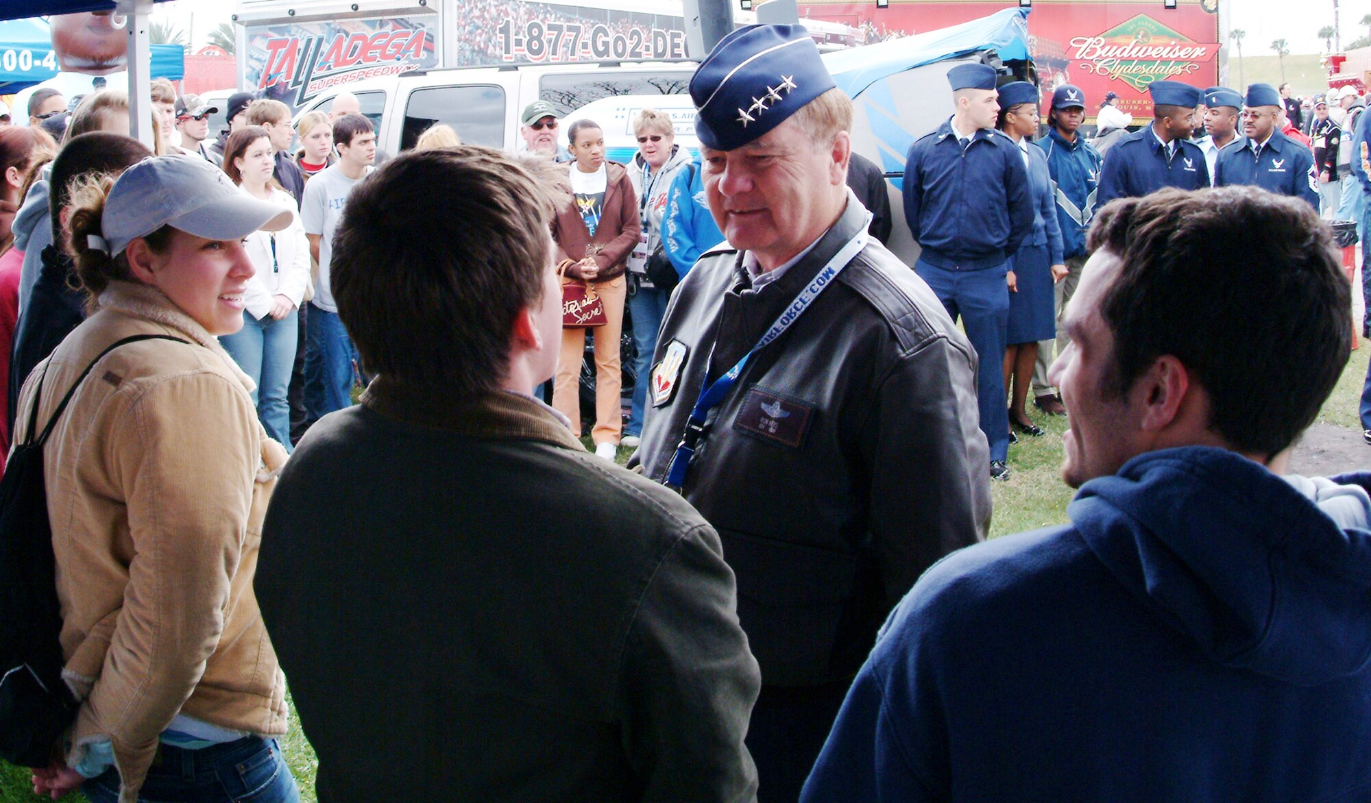 Gen. Ronald Keys, Air Combat Command commander, talks with Matt Dalton, a newly sworn-in Airman, before the Daytona 500 race Feb. 18 as other new Airmen observe.  General Keys gave the oath of enlistment to 36 delayed-entry-program recruits from the local area.  Afterward, the new Airmen and the general were treated to a tour of the garage and pit areas before the race.  The Air Force is one of the sponsors of the No. 21 Wood Brothers car driven by Ken Schrader.  (U.S. Air Force photo/Staff Sgt. Samuel King Jr.)