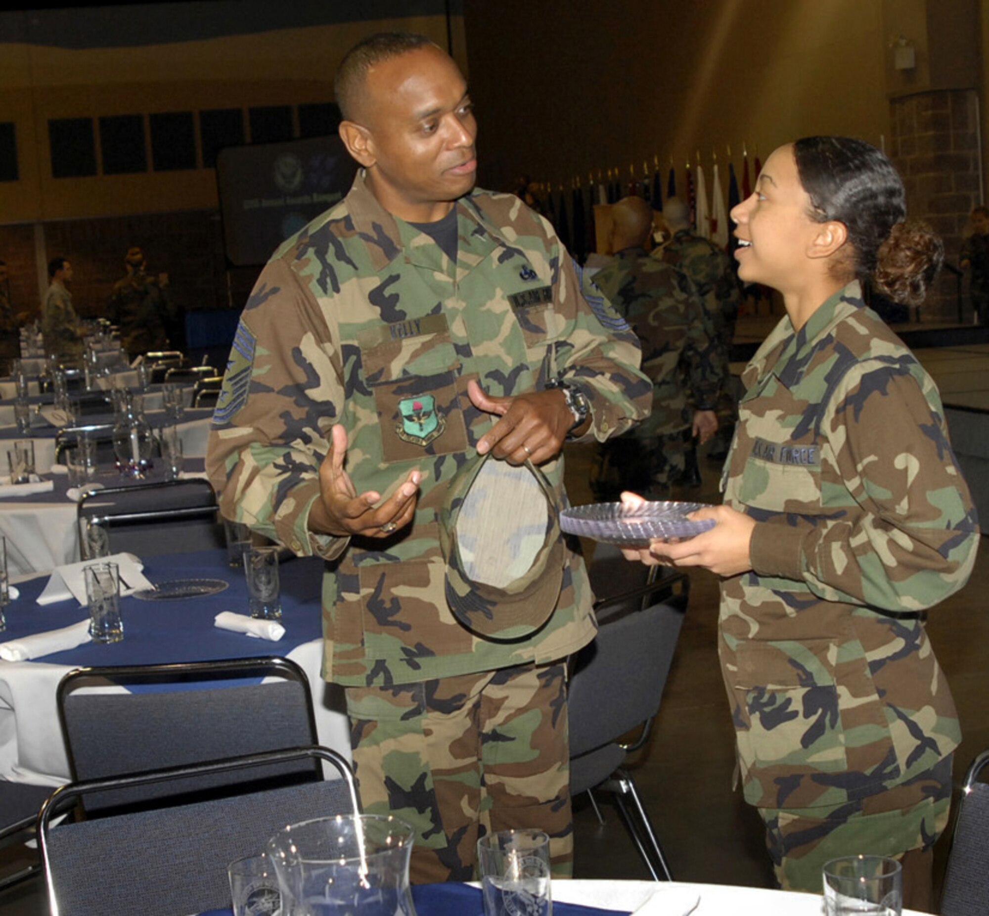 Chief Master Sgt. Jimmy Kelly, 2nd Air Force command chief, talks to an Airman-in-training Feb. 16 prior to the annual awards banquet. (U.S. Air Force photo/Harry Tonemah)