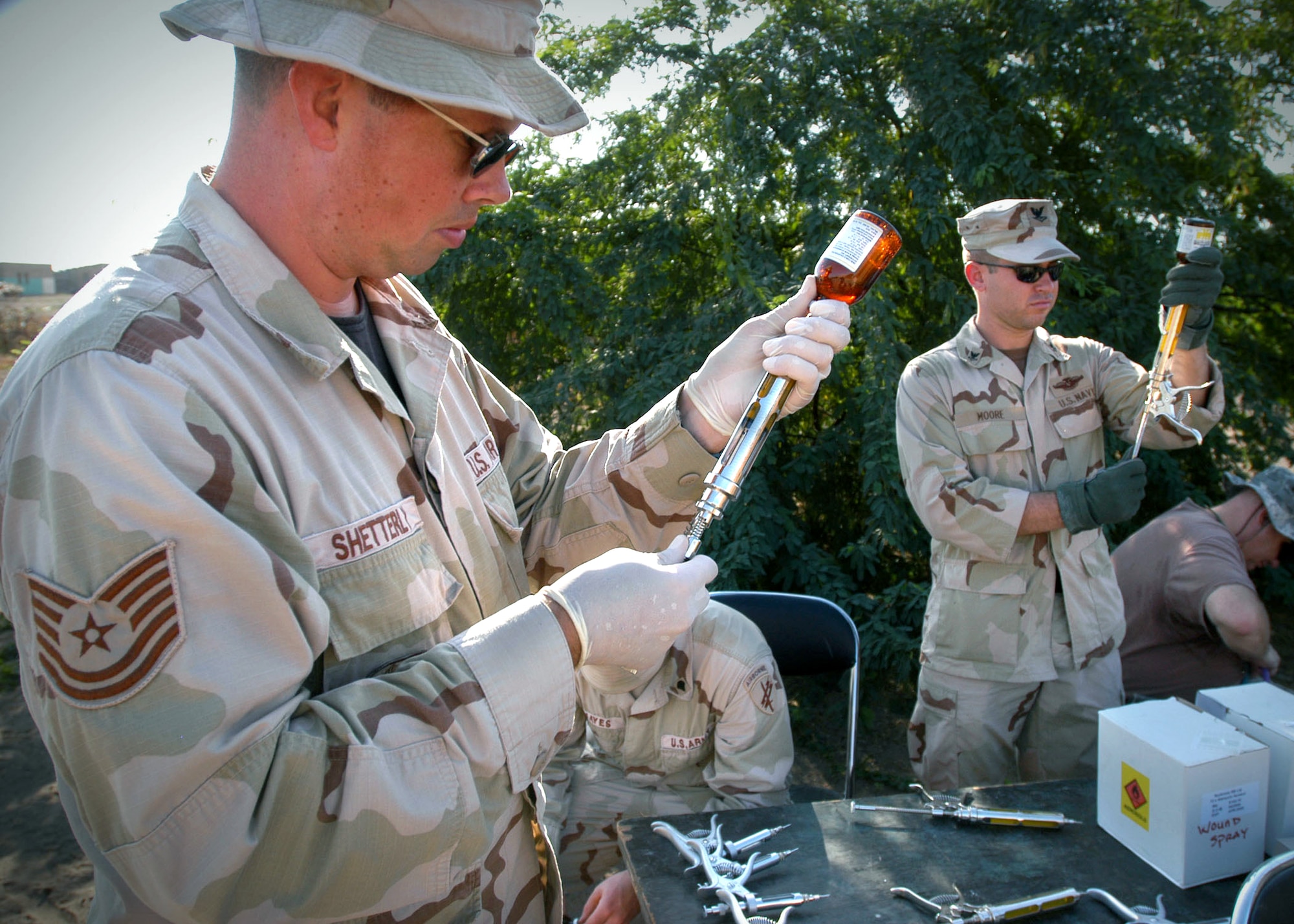 Tech. Sgt. Chris Shetterly and other medical personnel prepare medications Jan. 9 for a veterinarian civil action program sponsored by the Combined Joint Task Force - Horn of Africa in the Damerjong district, Djibouti.  (U.S. Navy photo/Chief Petty Officer Eric A. Clement)