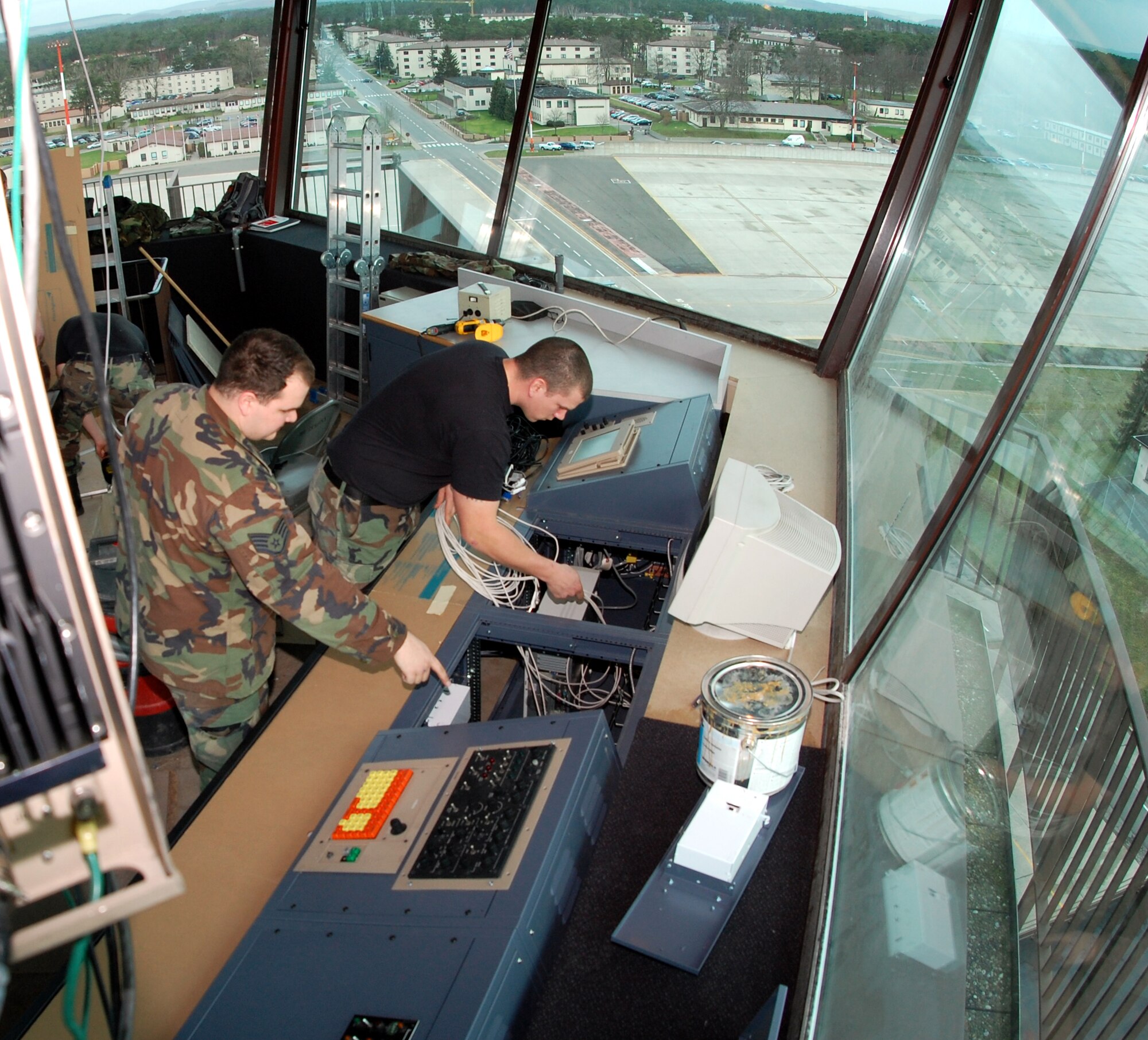 Staff Sgts. David Coleman and Michael Sweet rewire components Feb. 14 during the renovation of the air traffic control tower at Ramstein Air Base, Germany.  The tower is undergoing approximately $300,000 worth of upgrades.  Work is progressing on time and within budget.  The tower staff expects to be fully operational in the "new" tower by March 1.  (U.S. Air Force photo/Staff Sgt. Dan Bellis) 