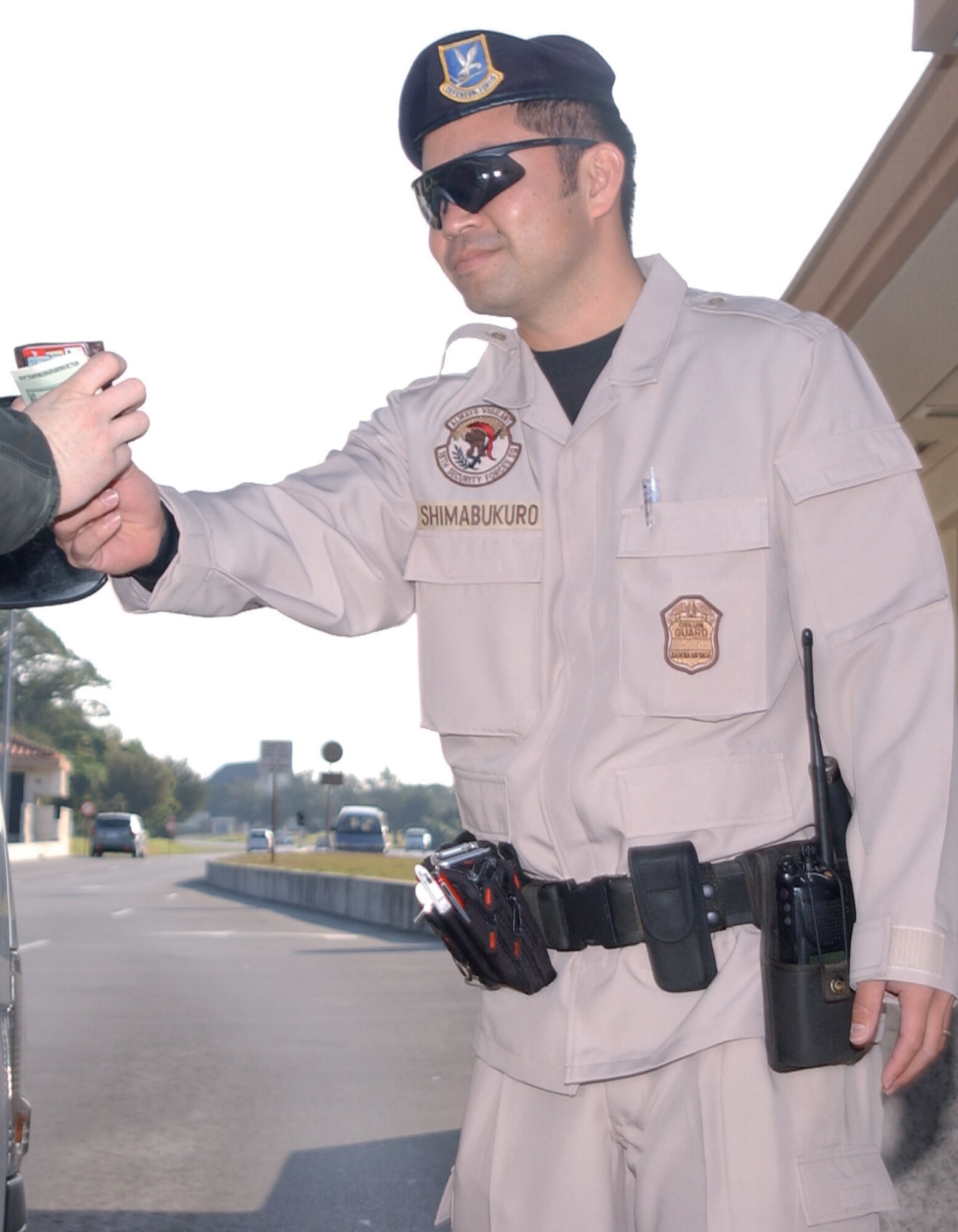 KADENA AIR BASE, Japan -- Susumu Shimabukuro, 18th Security Forces Squadron civilian gate guard, in the proposed uniform for the guards. (U.S. Air Force/Airman 1st Class Ryan Ivacic)