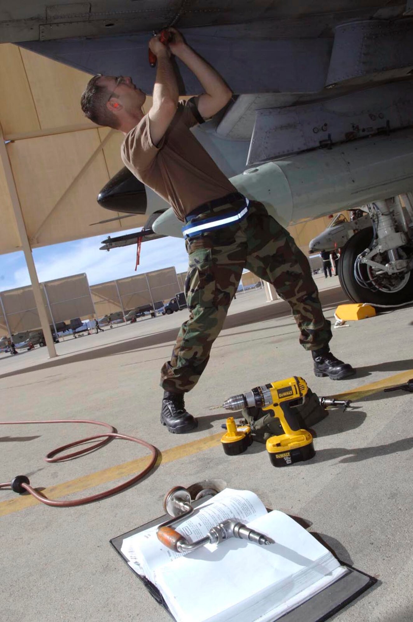 Staff Sgt. Christopher Jackson works on an A-10 Thunderbolt II Feb. 17 during an operational readiness exercise at Davis-Monthan Air Force Base, Ariz., being conducted by the Air Combat Command inspection team. The ACC inspectors test the ability of 355th Wing Airmen to prepare to deploy and fight when called. Sergeant Jackson is a metals technician assigned to the 355th Equipment Maintenance Squadron.  (U.S. Air Force photo/Senior Airman Christina D. Ponte)