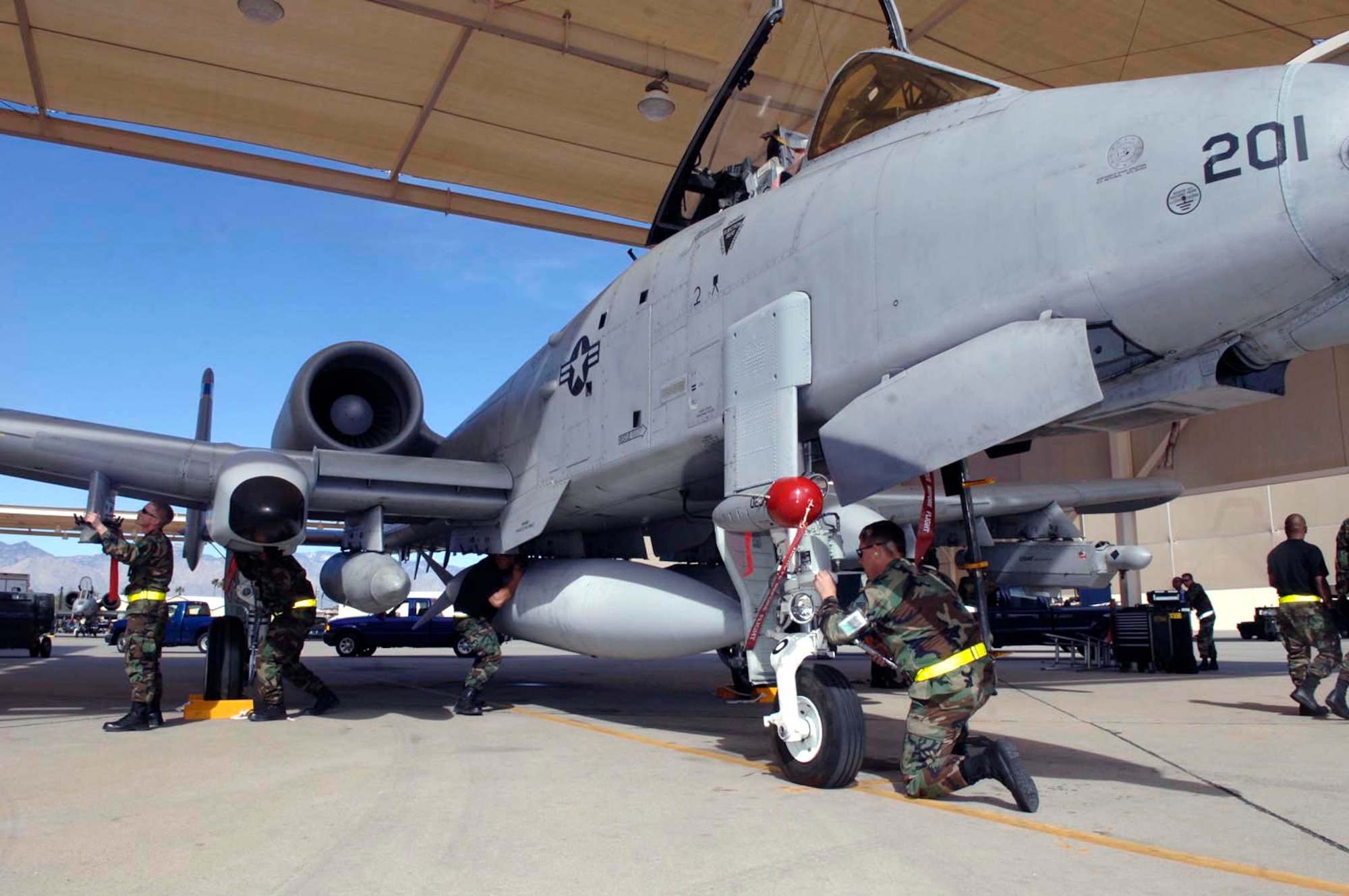 Airmen from the 355th Maintenance Group prepare an A-10 Thunderbolt II for launch Feb. 17 during an operational readiness exercise at Davis-Monthan Air Force Base, Ariz., being conducted by the Air Combat Command inspection team. The ACC inspectors test the ability of 355th Wing Airmen to prepare to deploy and fight when called.  (U.S. Air Force photo/Senior Airman Christina D. Ponte)