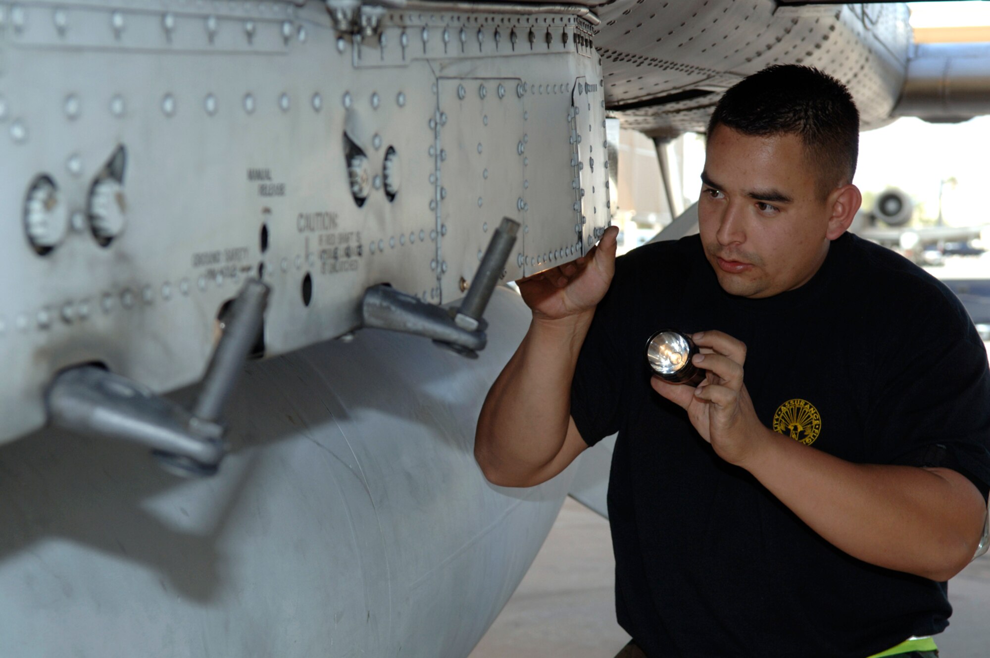 Staff Sgt. Orlando Mendoza performs a maintenance inspection on an A-10 Thunderbolt II Feb. 17 during an operational readiness exercise at Davis-Monthan Air Force Base, Ariz., being conducted by the Air Combat Command inspection team. The ACC inspectors test the ability of 355th Wing Airmen to prepare to deploy and fight when called.  Sergeant Sangfield is a weapons team chief assigned to the 355th Maintenance Group.  (U.S. Air Force photo/Senior Airman Christina D. Ponte)