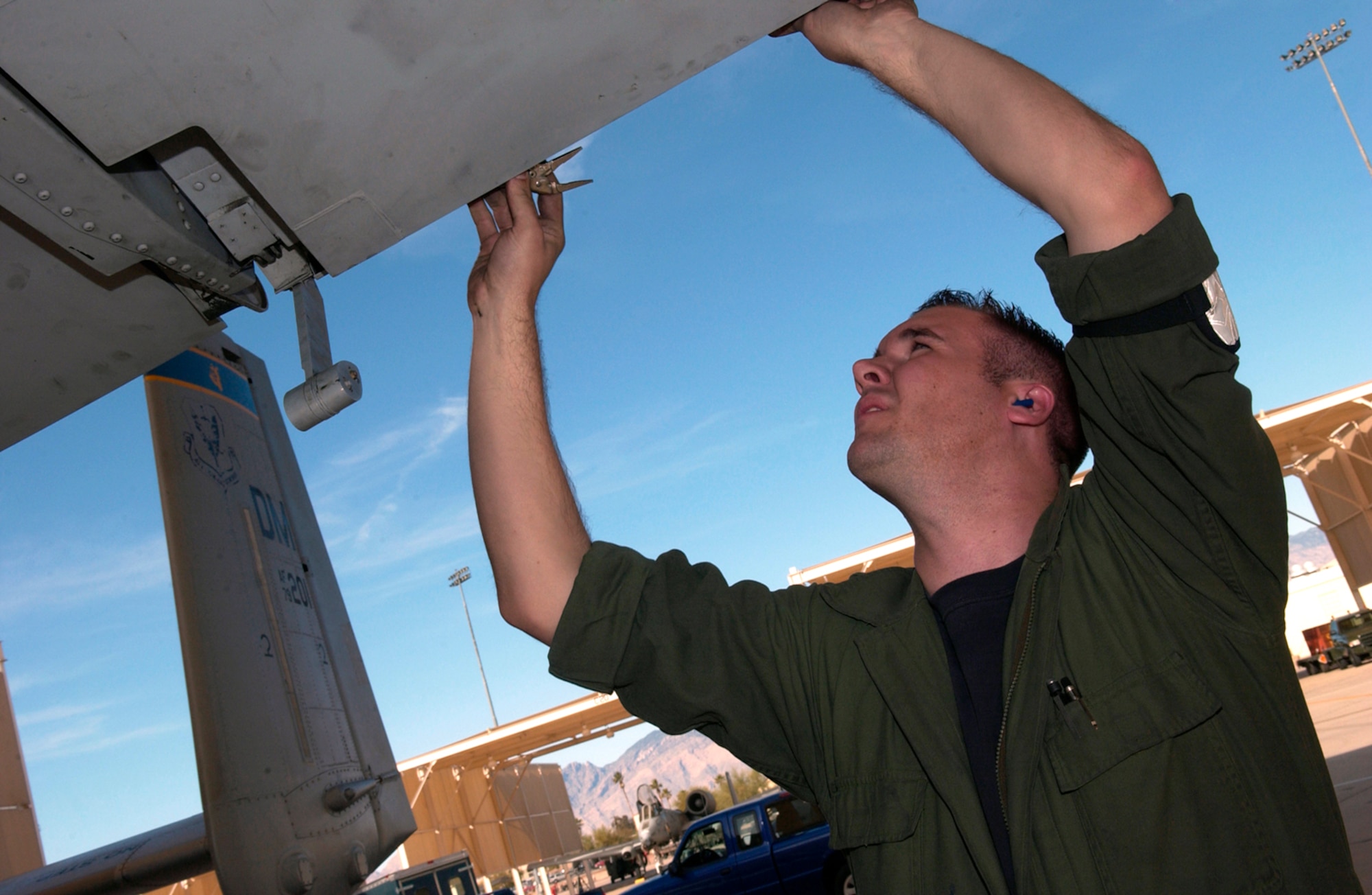 Staff Sgt. Brian Yorke works on an A-10 Thunderbolt II Feb. 17 during an operational readiness exercise at Davis-Monthan Air Force Base, Ariz., being conducted by the Air Combat Command inspection team. The ACC inspectors test the ability of 355th Wing Airmen to prepare to deploy and fight when called. Sergeant Yorke is assigned to the 355th Equipment Maintenance Squadron.  (U.S. Air Force photo/Airman 1st Class Alesia Goosic)