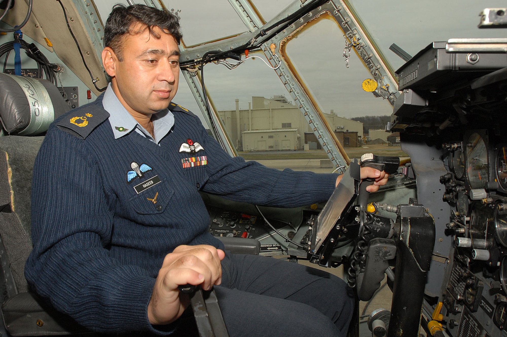 Pakistan air force Wing Commander Hasseb Gul tests flight controls on a C-130 Feb. 8 at Little Rock Air Force Base, Ark. Members of the Pakistani air force visited to observe C-130 operations procedures training. (U.S. Air Force photo by A1C Nathan Allen)