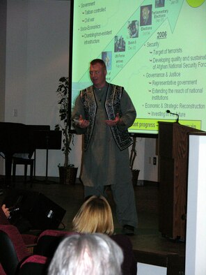 Capt. Ted Janicki, a reservist with the 916th Air Refueling Wing and a professor at Mt. Olive College, gave a presentation to more than a 100 people in mid-February while home on leave from Afghanistan. Capt. Janicki volunteered to serve a year tour in the Middle Eastern country starting last summer and while home on leave decided to share his experiences with the local community. Capt. Janicki, dressed in authentic Afghani garb, a gift from his interpreter, is helping Afghan troops learn about the communications career field. (U.S. Air Force photo/ Ms. Donna Lea)
       