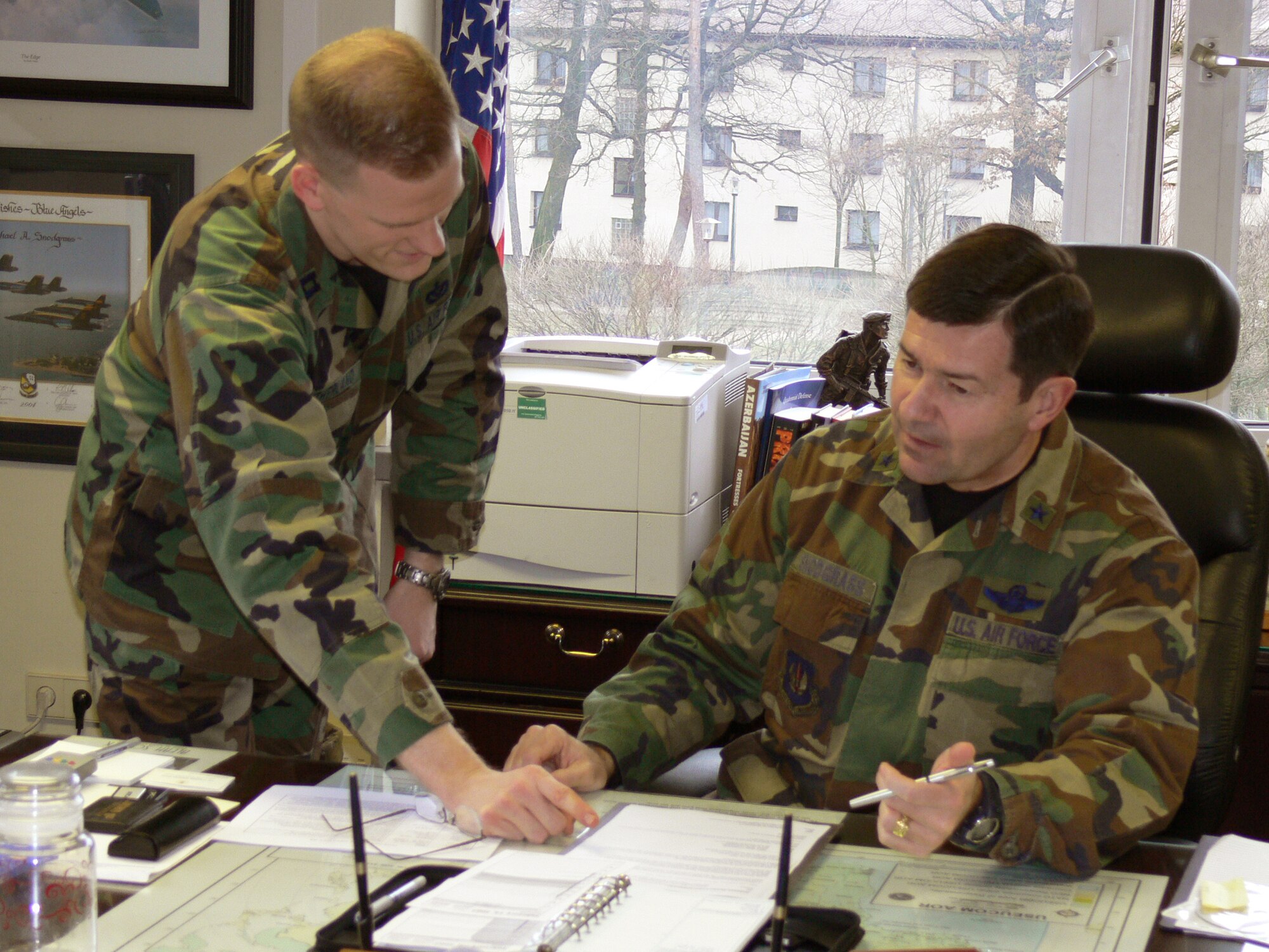 Brig. Gen. Michael Snodgrass discusses ongoing USAFE operations on the African continent with his executive officer Capt. Sean Sutherland.  As the A5, Brig. Gen. Snodgrass is the Director of Plans, Programs, and Analysis for Headquarters, U.S. Air Forces in Europe at Ramstein Air Base, Germany.  USAFE has had an active role in Africa since the 1970’s but is awaiting word from the new US Africa Command transition team to determine its future direction.
