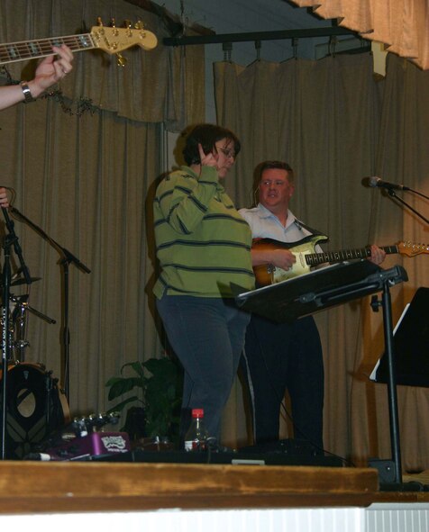 Kandyce Weaver, a teacher at Sheppard Elementary, participates in an impromptu dance contest during the Top Flight concert. (U.S. Air Force Photo/Staff Sgt. Tonnette Thompson)