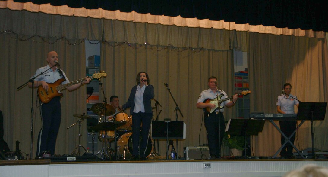 Top Flight bandmembers bass guitarist Tech. Sgt. Jon Packard, drummer Airman 1st Class Andy Wendzikowski, lead singer Tech. Sgt. Donna Siler, guitarist Tech. Sgt. Steve Wilson and keyboardist Master Sgt. Sarah DeLuzio.  The band entertained the students at Sheppard Elementary Feb. 12. (U.S. Air Force Photo/Staff Sgt. Tonnette Thompson)