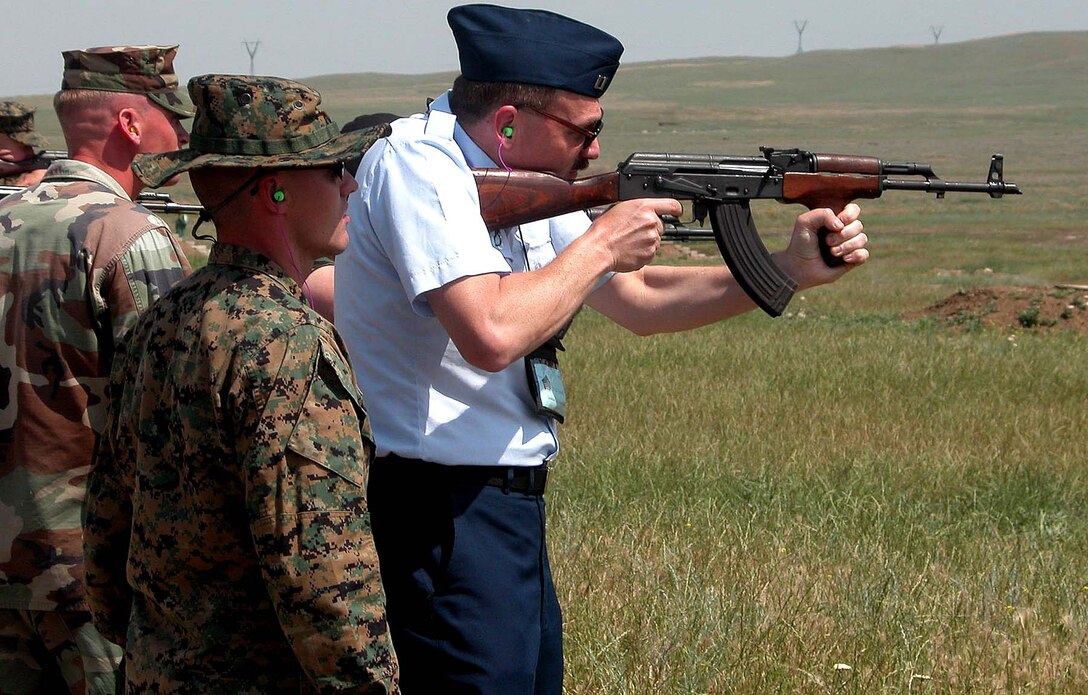 a-marine-corps-noncommissioned-officer-watches-as-coast-guard-lt-brad