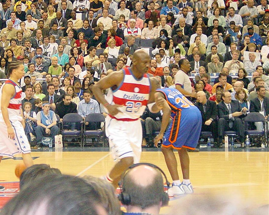 Michael Jordan hustles down the court in his last home game  April 14, wearing the throwback home jersey representing the 1978 team that won  the NBA championship. The star NBA won the attendees' hearts, even though his  team, the Wizards, lost the game against the New York Knicks, 93-79. Photo by  Master Sgt. Phillip Copeland