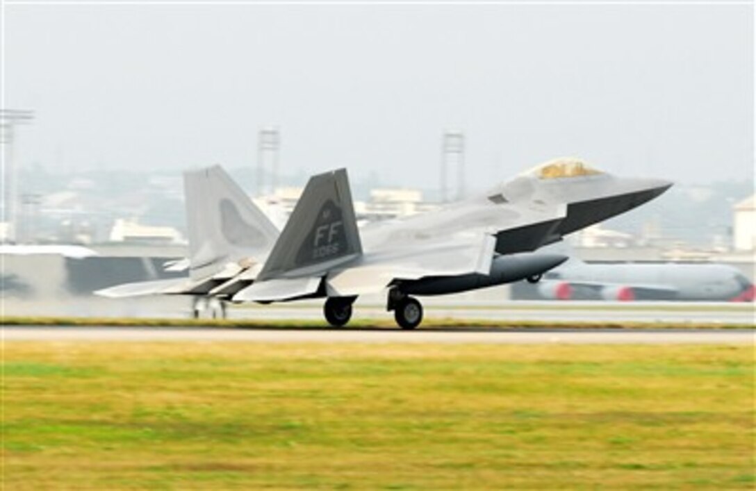 An F-22 Raptor lands at Kadena Air Base, Japan, Feb. 18, 2007, marking the aircraft's first overseas deployment. The jet is one of 12 along with more than 250 Airmen deployed from Langley Air Force Base, Va., to Kadena as part of an air expeditionary force rotation.