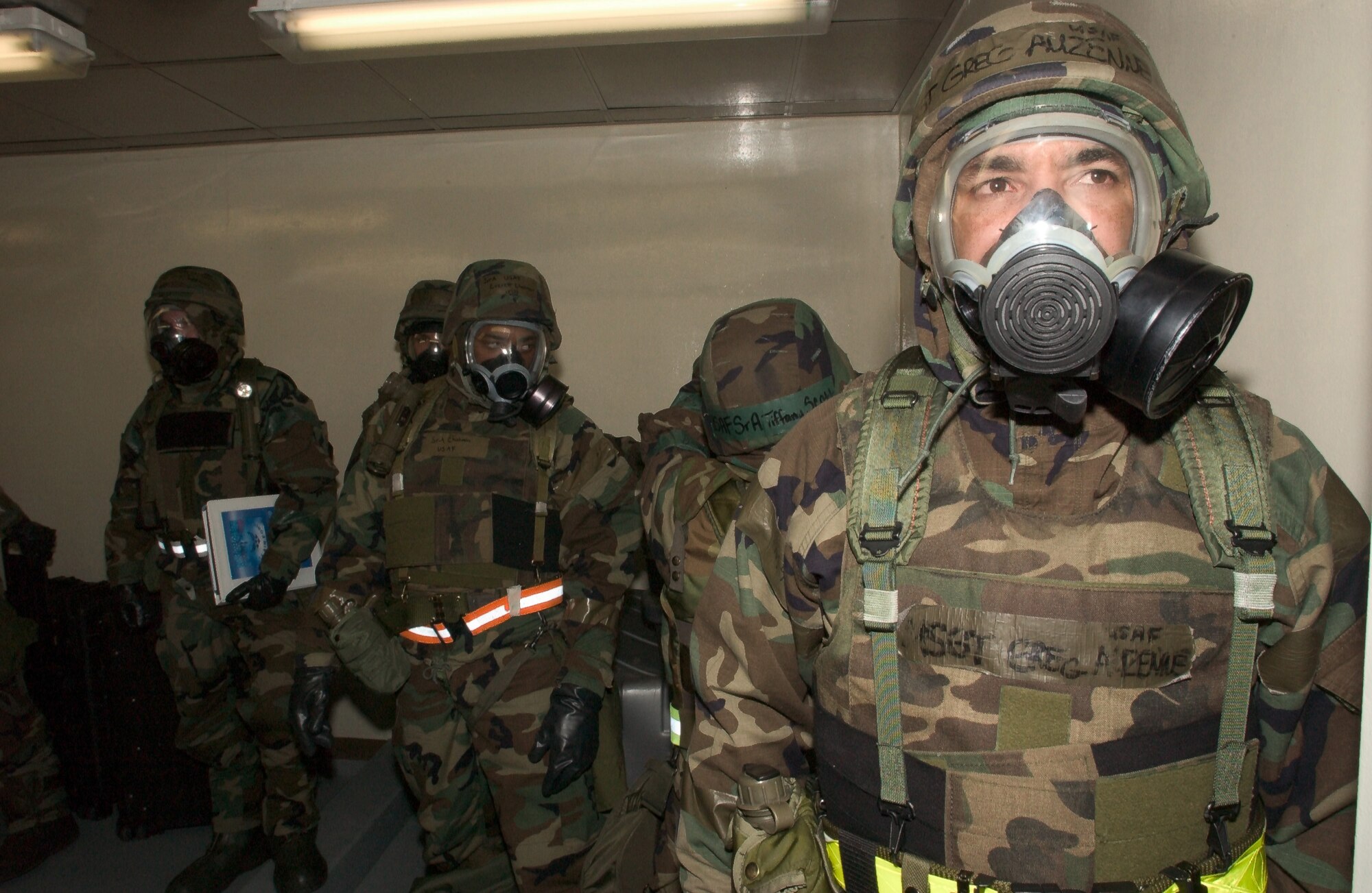 Staff Sgt. Gregory Auzenne, from the 8th Aircraft Maintenance Squadron, waits in line to evacuate to an alternate facility after a simulated chemical attack during exercise ?Beverly Midnight? at Kunsan AB, Republic of Korea, on Wednesday, February 21, 2006.  (U.S. Air Force Photo/Senior Airman Barry Loo)
