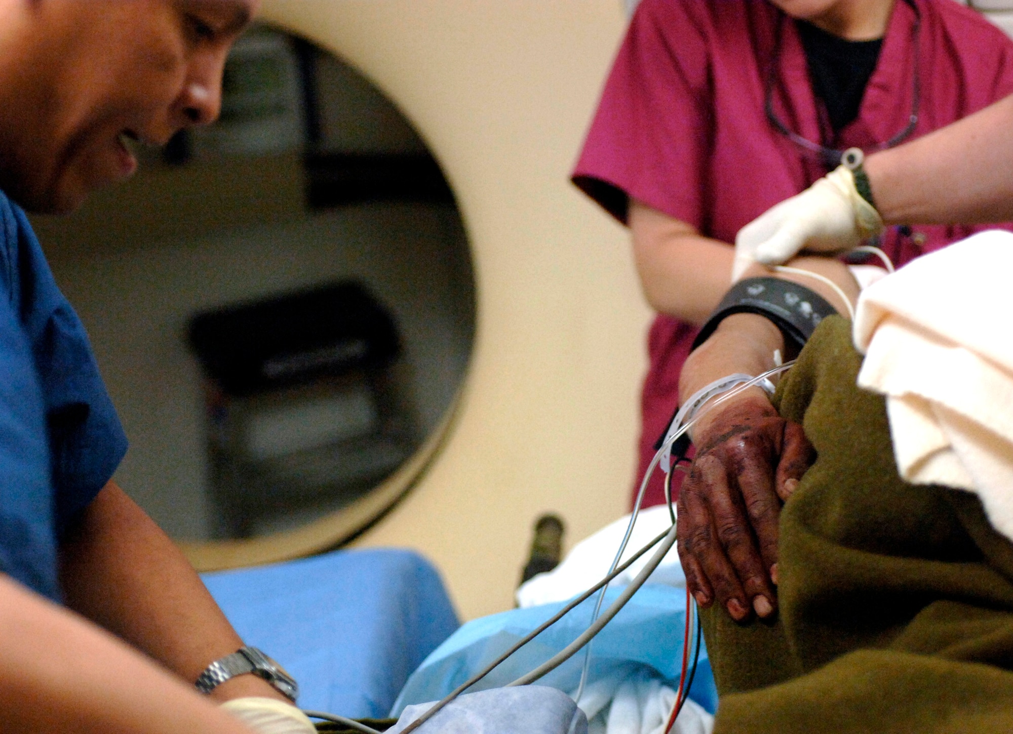 Staff Sgt. Orlando Martinez prepares a patient for a CT scan at the Air Force Theater Hospital Feb. 19 at Balad Air Base, Iraq. The radiology staff has two new 16 slice CT scanners that expedite the process from 90 minutes to about 10 minutes. Sergeant Martinez is a diagnostic imaging specialist assigned to the 332nd Expeditionary Medical Group. (U.S. Air Force photo/Tech. Sgt. Cecilio M. Ricardo Jr.)
