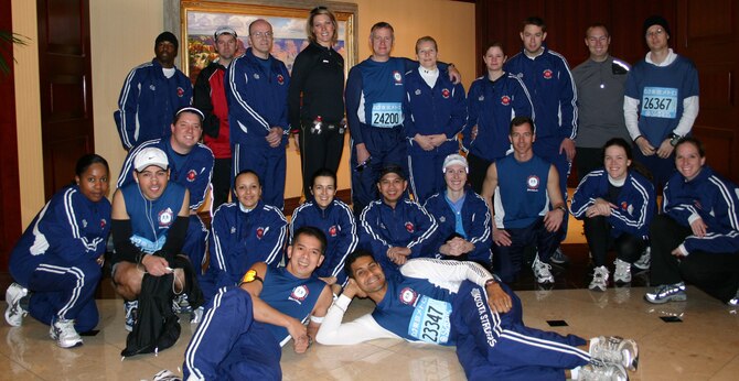 YOKOTA AIR BASE, Japan -- Yokota Air Base community members pose prior to running in the 2007 Inaugural Tokyo Marathon Sunday. More than 30,870 runners endured cold temperatures and rain while completing the 26.2 mile run. Runners from Yokota had the following approximate completion times: Elizabeth Welliver, 3:44:23; Paula Thomas, 4:27:27; Karla Slater, 4:54:39; Rosa Cervantes, 5:11:23; Amanda Scoughton, 5:26:26; Abby Smith, 5:32:31; Kelly Swenson, 5:39:05; Amber Fagan, 5:42:37; Katherine Bailey, 5:42:40; Blair Downs, 5:42:40; Maria Franz, 5:45:12; Joseph Williams, 3:09:07; Patrick Mally, 3:23:06; Jonathan Patin, 3:43:22; Anthony Thomas, 3:49:30; Ronald Cournoyer, 3:52:52; Aldrin Solidum, 3:55:33; Chris Chevalier, 4:02:44; Terry Cormier, 4:08:42; Brian Fagan, 4:20:24; Thomas Petterson, 4:25:13; Kevin Johnson, 4:43:10; Allen Thomas, 4:55:02; Nathaniel
Bernardo, 5:15:58; Kevin Swenson, 5:39:05; Scott Cornett, 6:14:40; Patrick Smith, 6:52:34 and Makiko Ikeda, 4:52:25. (U.S. Air Force photo)