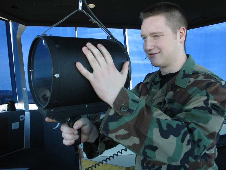 Airman 1st Class Kyle Sweiderk, 92nd Operations Support Squadron air traffic controller, views surrounding aircraft through a Digital Radar Display in the control tower. Airman Sweiderk has been chosen to represent the Air Force in the Air Force Recruiting Service publication, Technology Education Magazine. (Photo by Staff Sgt. Connie L. Bias)
