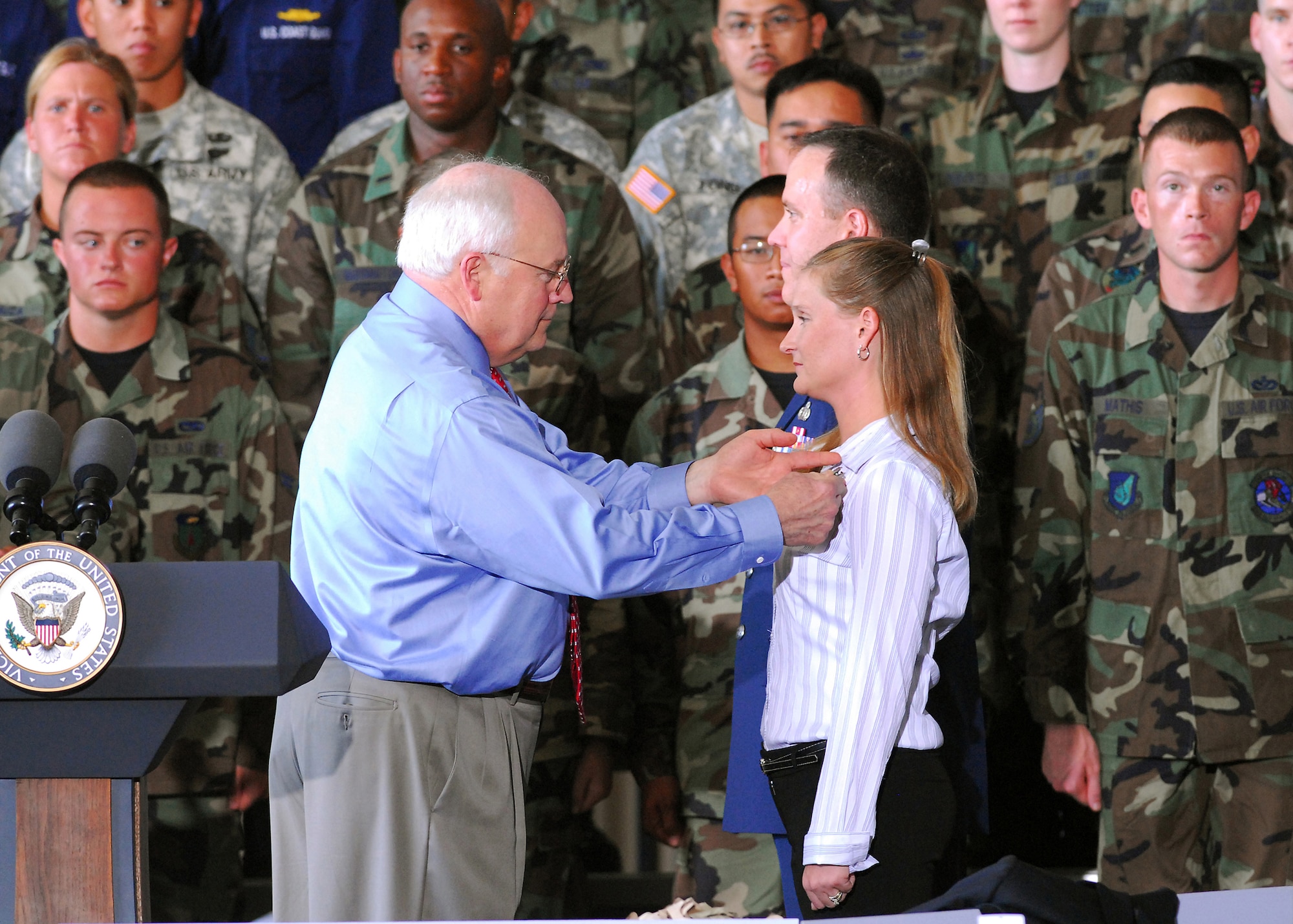 Vice President Dick Cheney pins Tracy A. McVay with the Exceptional Service Award at Andersen Air Force Base, Guam, on Feb. 22. Mrs. McVay distinguished herself by heroism involving voluntary risk of life at Tarague Beach, Guam on Jan. 27, 2007. (U.S. Air Force photo/Airman 1st Class Daniel Owen)
