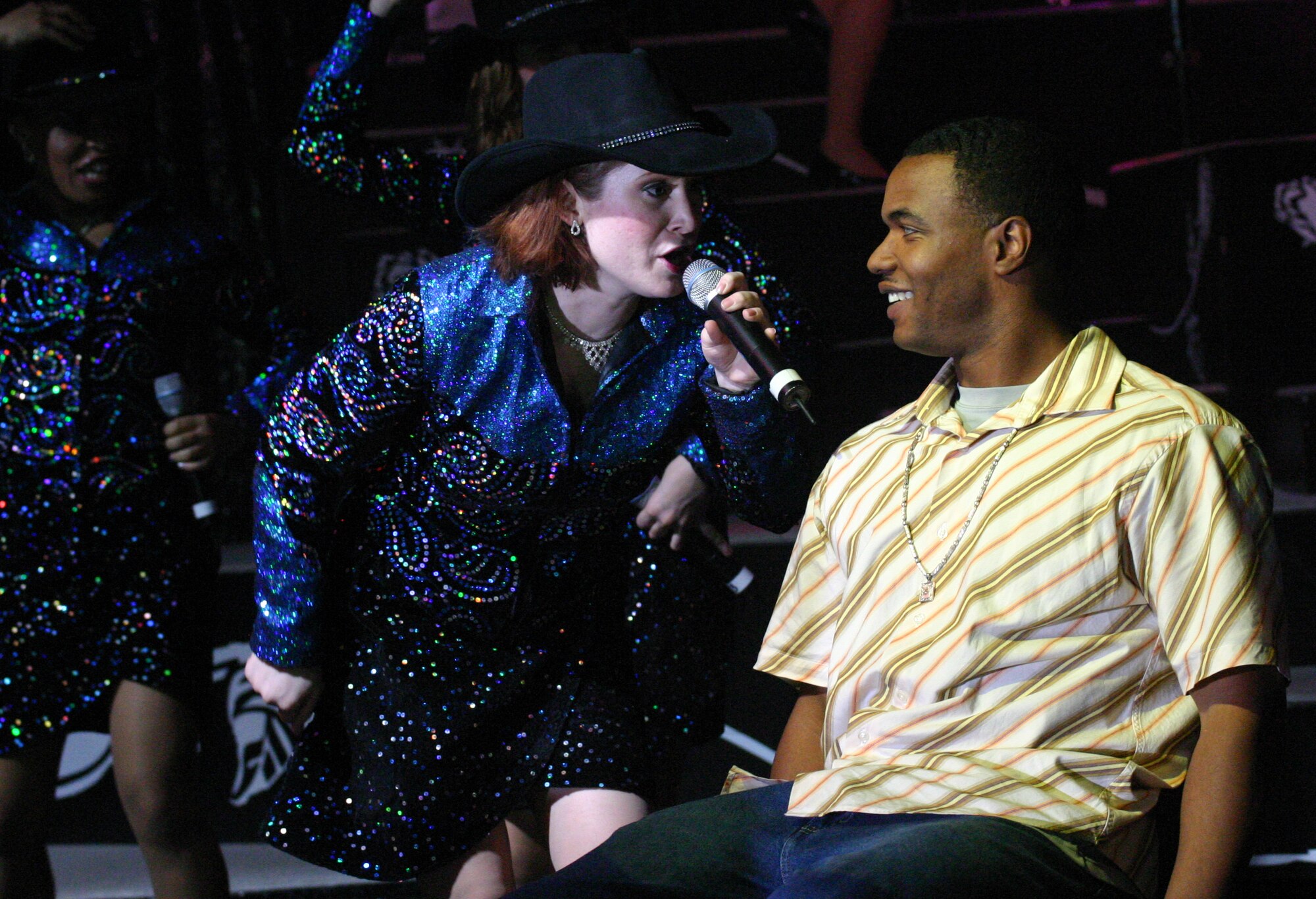 LAUGHLIN AIR FORCE BASE, TEXAS -- Tops in Blue vocalist 1st Lt. Rachel Rogers sings to Staff Sgt. Antonio Washington, 47th Services Division, during a free show at the Del Rio Civic Center Feb. 20.  (U.S. Air Force photo by Airman Sara Csurilla)