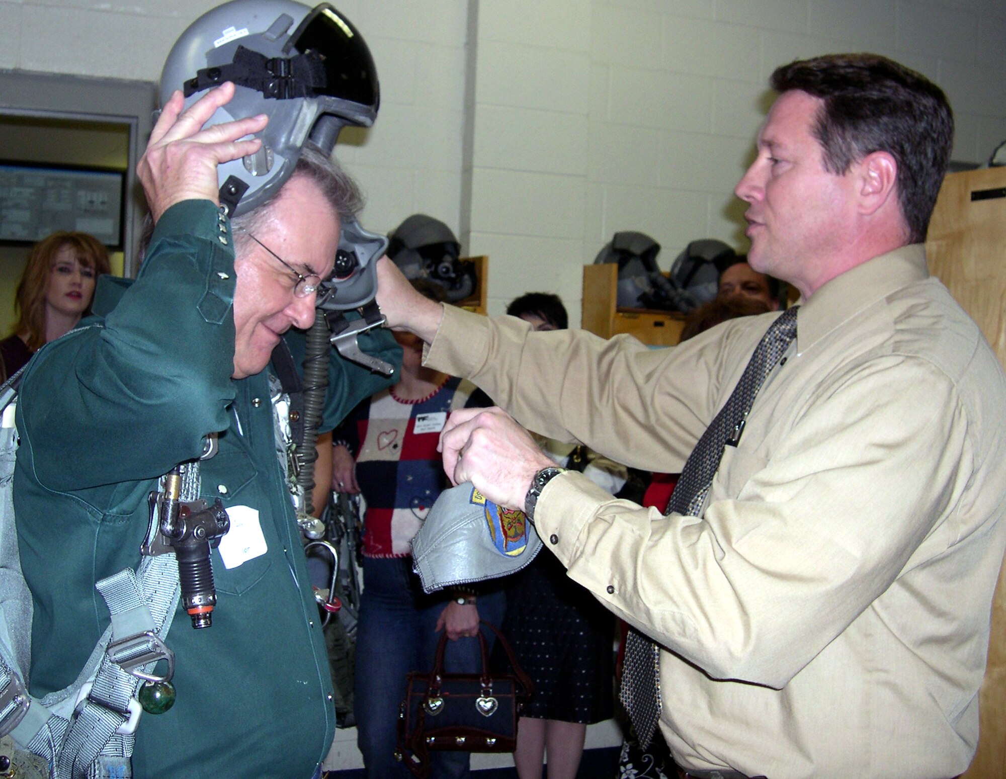 R.C. Taylor, left, a member of Leadership Wichita Falls Class of 2007, gets help donning life support equipment Feb. 20 from Jeff Roach, deputy director of the 80th Operations Group training section. Mr. Taylor was one of several area residents who are part of the 13-week program that develops future community leaders. (U.S. Air Force photo/Debi Smith)