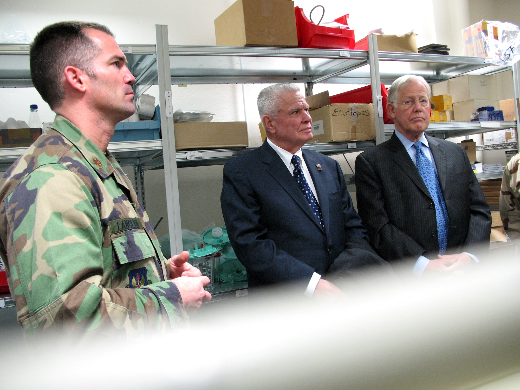 Dr. William Plested (center) and Dr. J. Edward Hill (right) get a tour of the Contingency Aeromedical Staging Facility Feb. 22 at Ramstein Air Base, Germany. They were joined by Maj. Paul Langevin, the CASF commander. Dr. Plested is the president of the American Medical Association, and Dr. Hill is the former AMA president. (U.S. Air Force photo/Staff Sgt. Laura Holzer) 