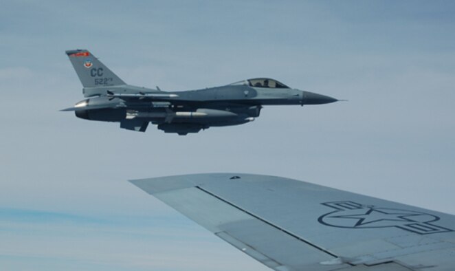 An F-16 from Cannon Air Force Base, N.M., flies off after being refueled by a Grand Forks Air Force Base, N.D., KC-135 during the Red Flag exercise Feb 7. A Two KC-135 Stratotankers from the 319th Air Refueling Wing are the lead tanker unit during the exercise. (U.S. Air Force photo/1st Lt. Randi Norton) 