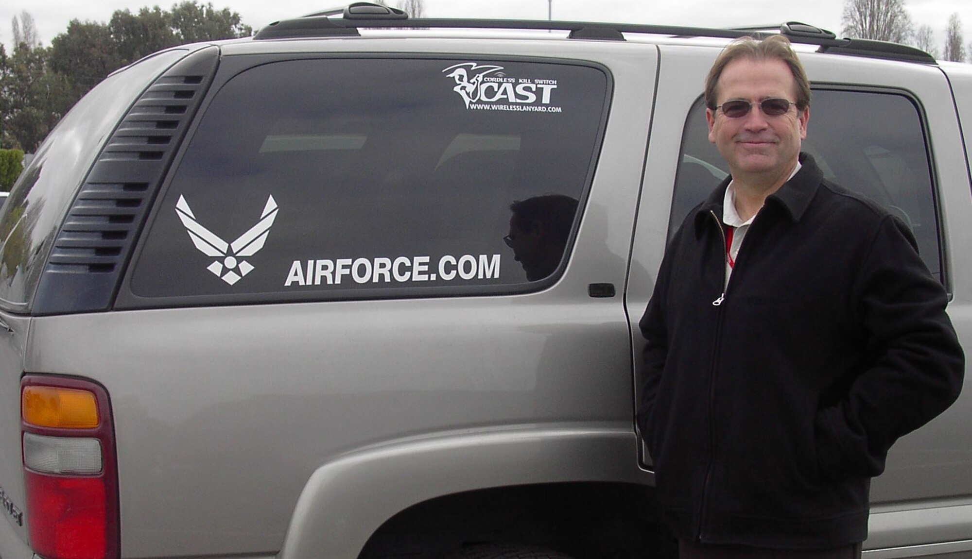 Dave Erwin stands by his vehicle displaying the Air Force Recruiting Web site. Mr. Erwin retired from the Air Force in 2001 and works here at Onizuka for Stellar Solutions.  He is also the country’s only professional angler officially sponsored by the Air Force. He was recently interviewed by a news crew about his 'Practice with a Pro' program, which is scheduled to air Feb. 27 as part of a newscast by ABC News anchor Bob Woodruff. (U.S. Air Force photo by Valerie Joseph)