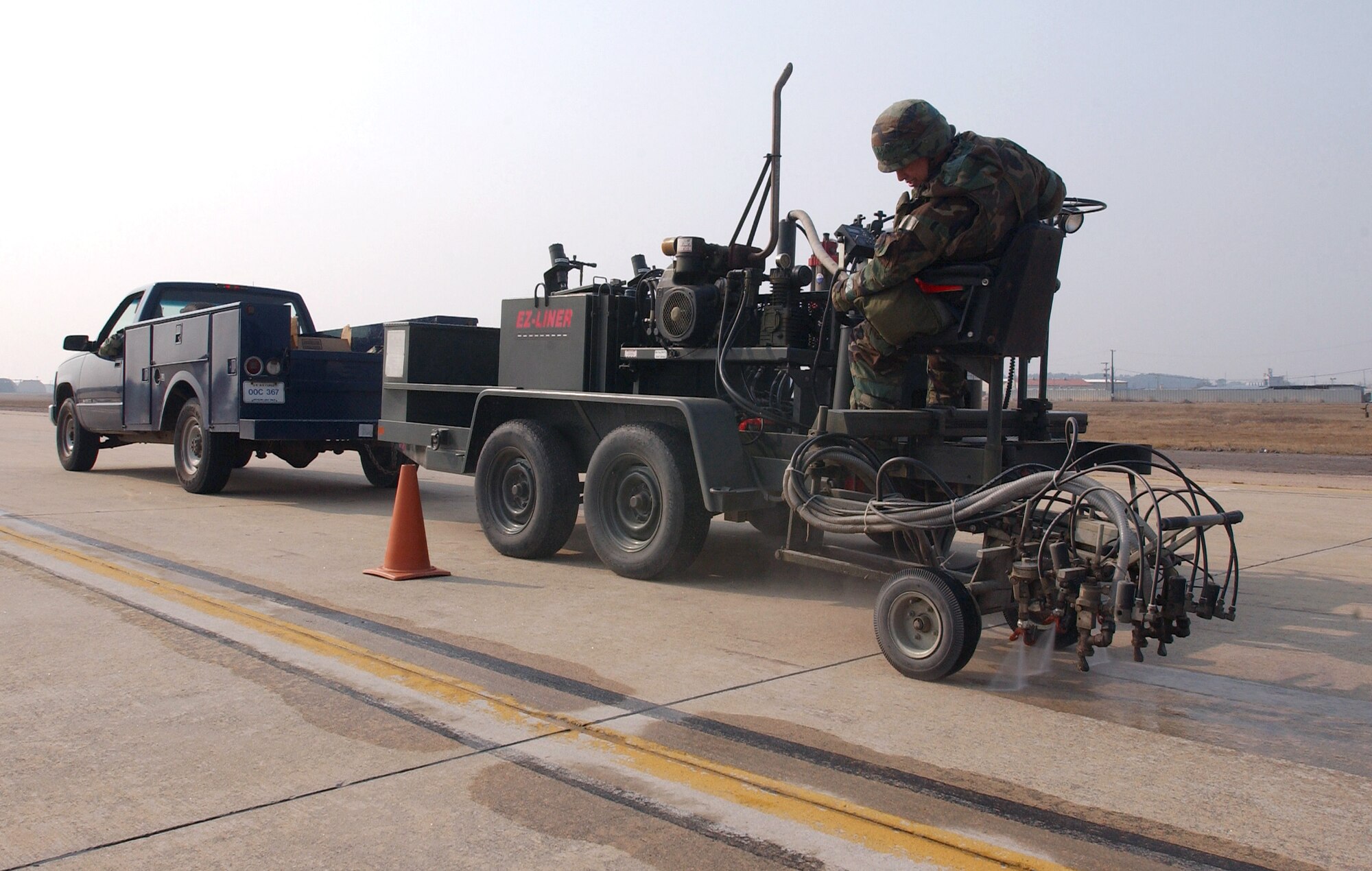 Staff Sgt. Jeremy Matanane prepares a runway for painting Feb. 21 during an operational readiness exercise at Kunsan Air Base, Korea.  Sergeant Matanane is a structural craftsman in the 8th Civil Engineer Squadron and is a member of the airfield damage repair team.  ADR teams do everything from crater repair to airfield lighting making it possible to get aircraft back in the air quickly. (U.S. Air Force Photo/Master Sgt. Jack Braden)