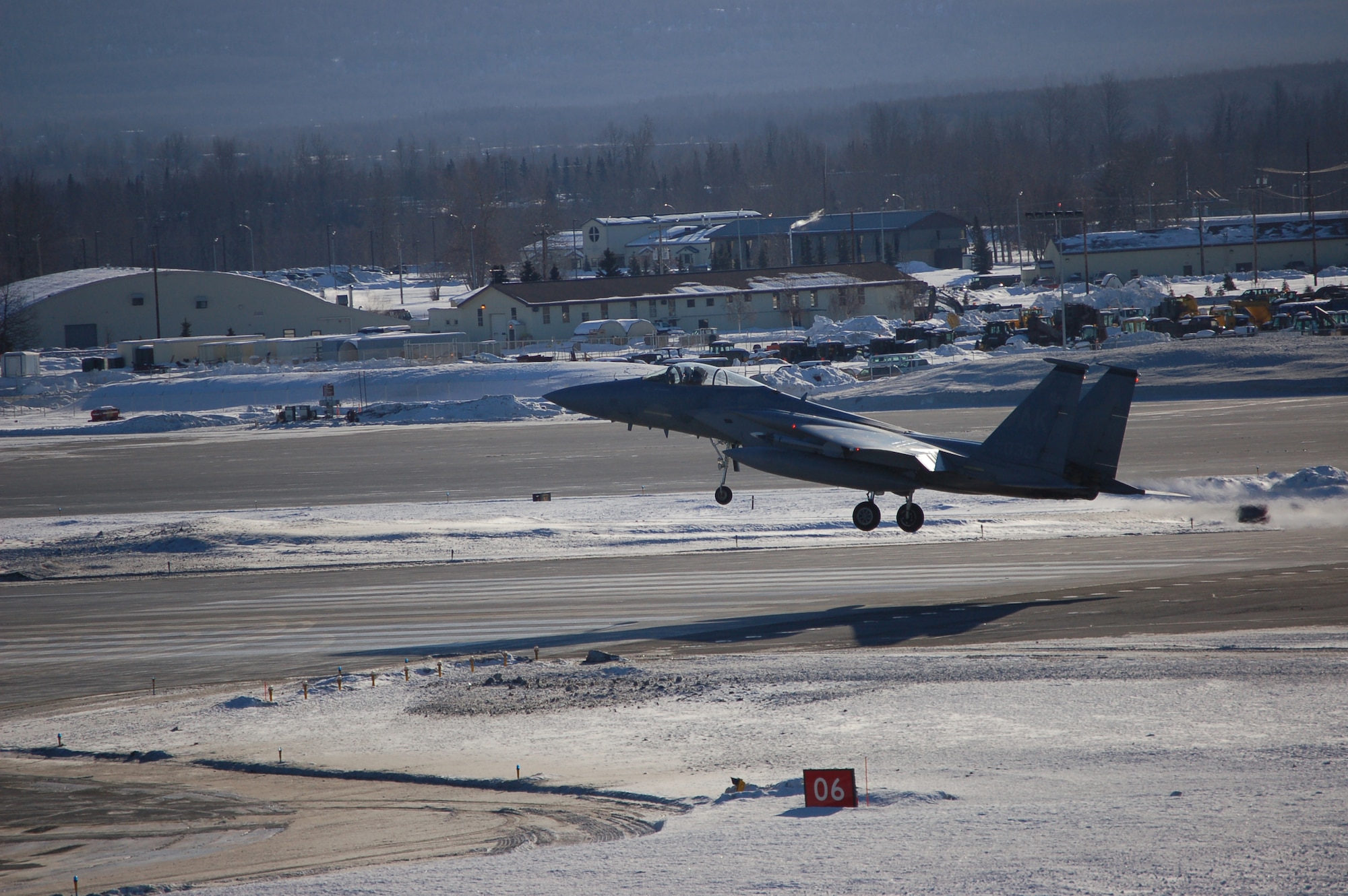 An F-15E Strike Eagle touches down on the flightline at Elmendorf Air Force Base, Alaska, Feb. 21 after a training mission. The F-15Es are only one part of the base's capabilities that support operations in Air Force Pacific Command. The fighter is with the 90th Fighter Squadron. (U.S. Air Force photo/Staff Sgt. Matthew Rosine) 