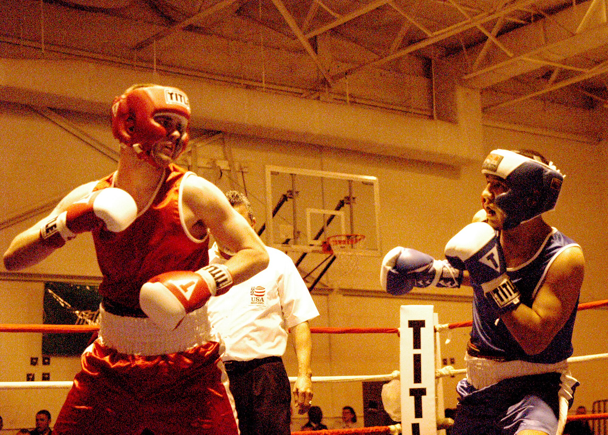 Matthew McCoy, left, from the 37th Logistics Readiness Squadron, prepares to punch Pete Villarreal from the Air Force News Agency, San Antonio, during the Air Force "Box-Offs" Feb. 17 at the Bennett Fitness Center on Lackland Air Force Base, Texas. (USAF photo by Alan Boedeker)                              