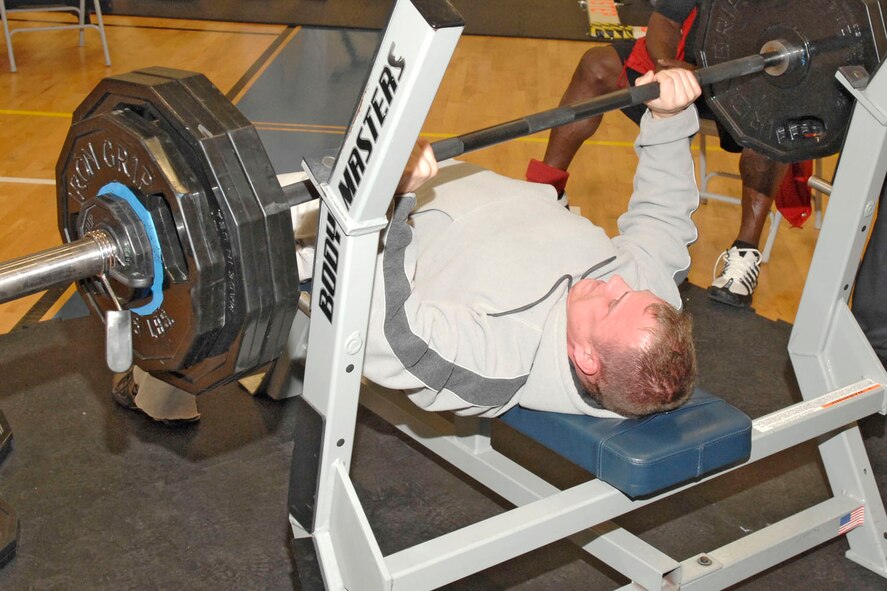 EGLIN AIR FORCE BASE, Fla. -- Michael Clark, a senior airman with the 96th Logistics Readiness Squadron, pushes 320 pounds to win the bench press competition for the men?s 155-179 pound weight class. Bobby Harnison won the Up to 154 Pound class; Darrel Pearman won the 180-199 pound weight class; Miguel Camacho won the 200-224 weight class; Rick Roell won the 225 and over class; and Pam Ives the women's competition. (USAF photo by Bruce Hoffman)