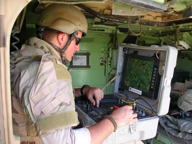 Army Commendation Medal recipient Senior Airman Joshua Wilson, an EOD technician, operates a Talon robot while sitting in a Bradley fighting vehicle while on a mission in Eastern Iraq. The Talon robot is used to render IEDs safe by placing explosive charges on the IED with the arm of the robot.  (U.S. Air Force photo)
