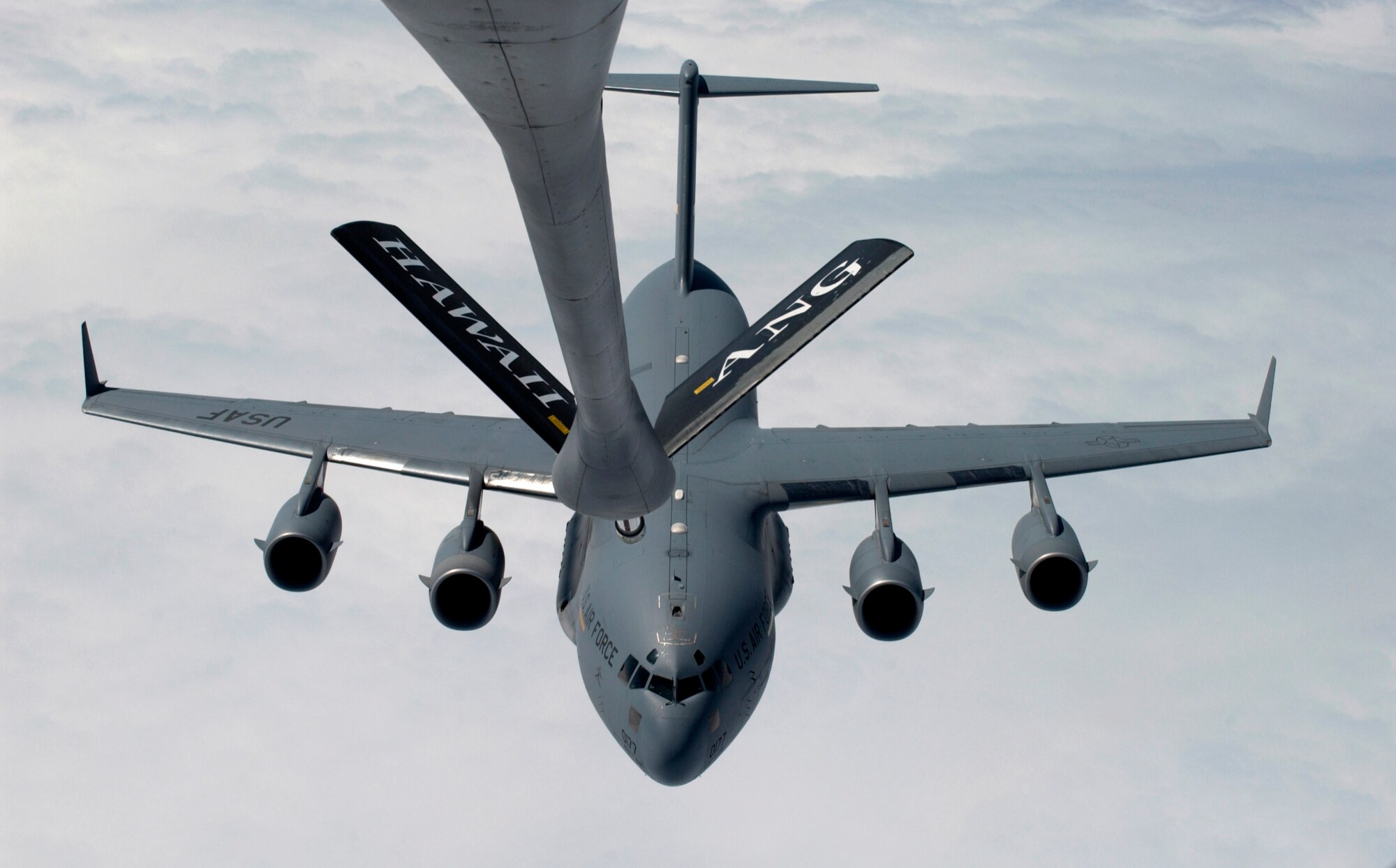 C-17 Globemaster IIIs, like this one, rely on aerial refueling to complete long-distance missions into and out of the theater of operations.  The large transports provide heavy airlift support, helping sustain operations throughout Afghanistan, Iraq and the Horn of Africa.  (U.S. Air Force photo/ Tech. Sgt. Shane A. Cuomo)