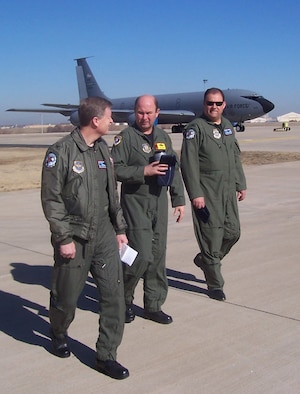 Col. Gregory L. Ferguson, 137th Airlift Wing vice commander, left; Col. Jeffery Glass, 507th Air Refueling Wing commander, center; and Col. James McCormack, 137th AW commander, discuss future Total Force refueling operations during an initial walk around tour of 507th ARW facilities on Feb. 21. The 137th AW, an Oklahoma Air National Guard wing, is slated to begin associate unit operations with the 507th ARW, an Air Force Reserve Command wing, later this fall. This represents the first time an ANG wing will be associated with an AFRC wing.