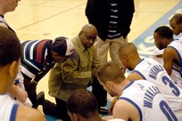 Warhawks' head coach, Jerome Riley, takes a time out to talk to his team during the Southwest Military Basketball League championship Feb. 17 at Brooks City-Base, Texas. The men's varsity basketball team from Lackland Air Force Base, Texas, won the game 92-70. (USAF photo by April Blumer)                                
