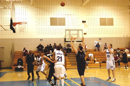 Warhawks' Kaleb Goss shoots a free throw during the Southwest Military Basketball League championship Feb. 17 at Brooks City-Base, Texas. The men's varsity basketball team from Lackland Air Force Base, Texas, won the game 92-70. (USAF photo by April Blumer)                                