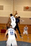 Warhawks’ Rodrick Greene wins the tip off against Laughlin’s R. Dobbins during the first round of the Southwest Military Basketball League championship Feb. 17 at Brooks City-Base, Texas. The men’s varsity basketball team from Lackland Air Force Base, Texas, won the game 92-70. (USAF photo by April Blumer)                                