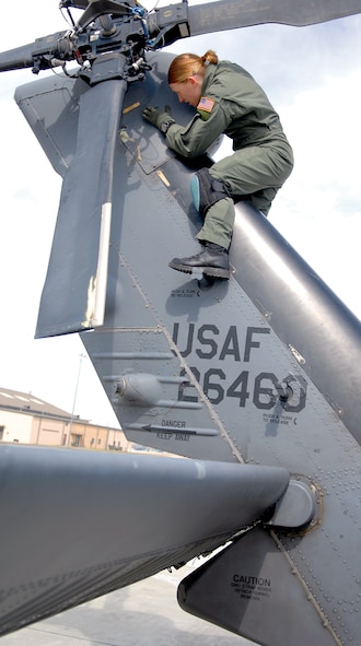 MOODY AIR FORCE BASE, Ga. -- Staff Sgt. Annette Nellis, 41st Rescue Squadron flight engineer, performs a preflight inspection on the tail rotor of an HH-60G Pave hawk.   (U.S. Air Force photo by Airman 1st Class Gina Chiaverotti)
