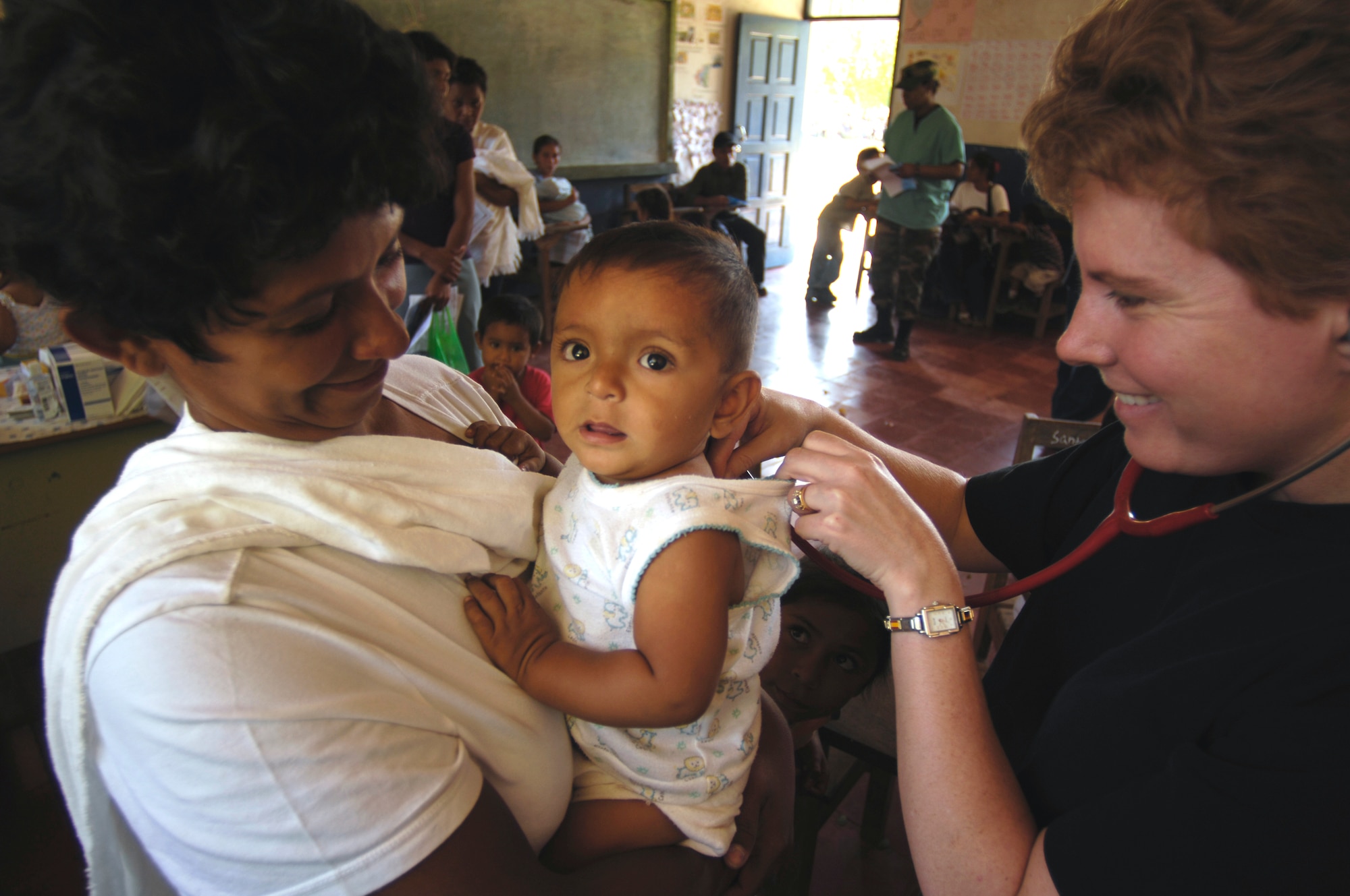 Maj. Dawn Peredo diagnoses a patient in Santa Teresa, Nicaragua, Feb. 19 during New Horizons-Nicaragua 2007, a military humanitarian and training exercise that provides aid and strengthens bonds between the two nations. (U.S. Air Force photo/Tech. Sgt. Kevin P. Milliken)