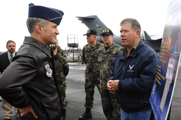 MCCHORD AIR FORCE BASE, Wash., -- Maj. Gen. James Hawkins, 18th Air Force commander, is briefed by Richard Arnold, right, 62nd Maintenance Squadron, on McChord's Air Force Smart Operations for the 21st Century initiatives on Feb. 13. (U.S. Air Force photo by Abner Guzman) 