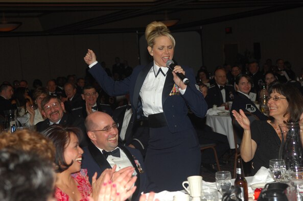 MINOT, N.D. -- Staff Sgt. Lara Murdzia, Night Wing vocalist, sings Aretha Franklin’s 1967 hit song "Respect" during the 5th Bomb Wing Annual Awards Banquet at the Holiday Inn in Minot Feb. 22. Each year the 5th BW holds an awards banquet to recognize Airmen and civilians who serve above and beyond in the areas of leadership, job performance, significant self-improvement and community involvement. Night Wing is part of the Air Force Heartland of America Band. (U.S. Air Force photo by Airman 1st Class Sharida Bishop) 
