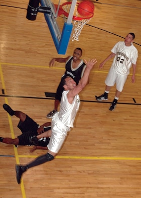 Mario Webb, 23rd Special Tactics Squadron, sinks a reverse lay-up during the Commandos' game against Moody Air Force Base, Ga. (U.S. Air Force photo by Staff Sgt. Mareshah Haynes)