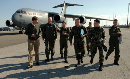 Dr. Ron Ritter, AFSO 21 special assistant to the secretary of the Air Force, and Brig. Gen. S. Taco Gilbert, AFSO 21 chief, walk with Charleston AFB, S.C., leaders on the flightline Feb. 16. (U.S. Air Force photo/Staff Sgt. April Quintanilla)