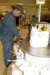 Staff Sgt. Patrick Van Winkle, 690th Information Support Squadron, uses one of the new six-bag self-check kiosks at the commissary on Lackland Air Force Base, Texas, during the lunch break. The Lackland Commissary is one of five testing sites for the new IBM hardware and software systems the Defense Commissary Agency is looking to use worldwide. (USAF photo by April Blumer)                                