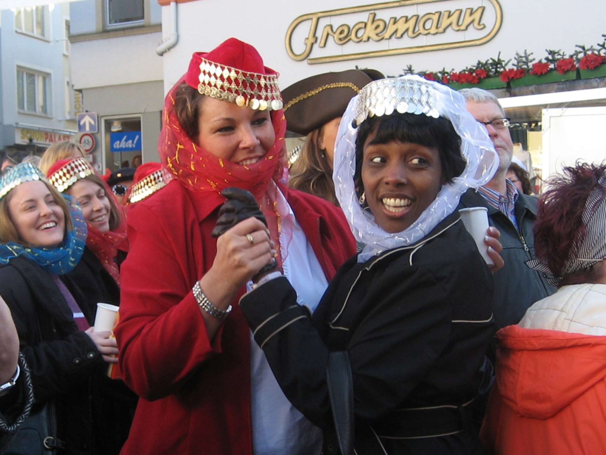 Charlette Banks (right), wife of Col. Sid Banks, 52nd Mission Support Group commander, and Gabi Brown, wife of Chief Master Sgt. Lovorn Brown, 52nd Medical Operations Squadron, enjoy fasching activities in Wittlich, Feb. 15. (US Air Force photo by Staff Sgt. Andrea Knudson)