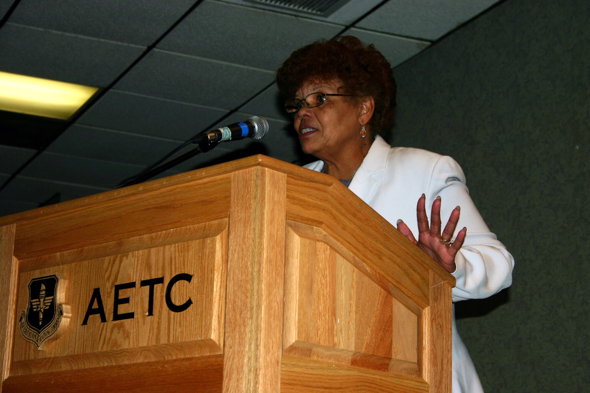 Betty Kilby Fisher, guest speaker at the African American Heritage luncheon Feb. 22, relates some of her life experiences to her audience.  Mrs. Fisher is the author of the book "Wit, Will and Walls." (U.S. Air Force Photo/Staff Sgt. Tonnette Thompson)