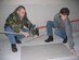 (Left) Tech. Sgt. Joe Jones, AMB member, and 1st Lt. Teri Hunter, MOS member,  measure drywall to be installed in a master bedroom Feb. 3.