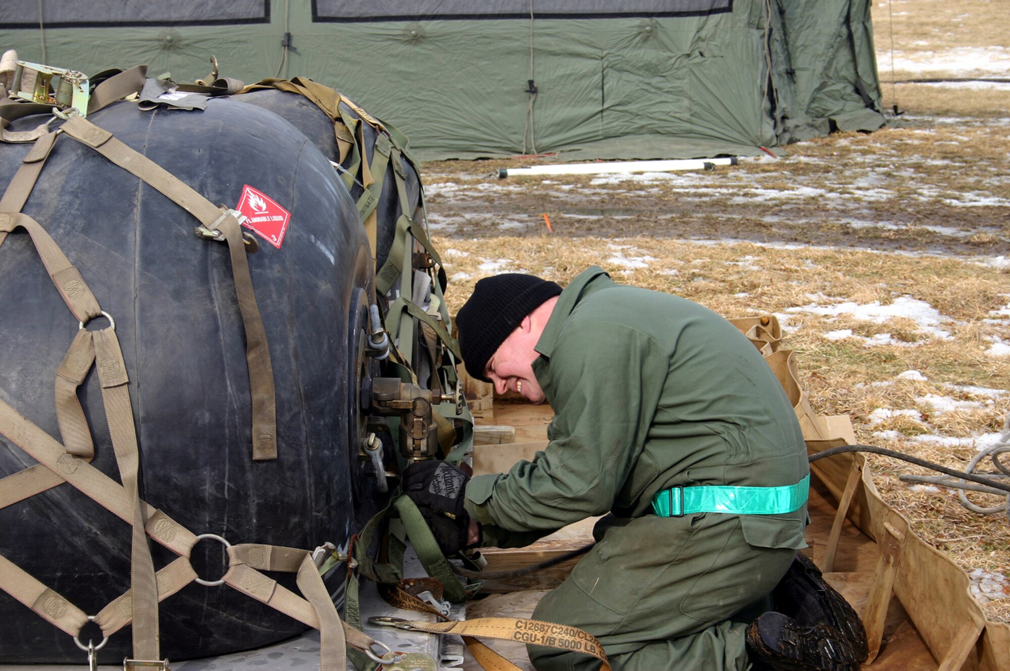 Staff Sgt. Sean Taylor, 819th Global Support Squadron aircraft ground equipment technician, connects the fuel lines for generators that will provide power to a tent city during the 621st Contingency Response Wing Mobility Exercise Tuesday. The four-day event included more than 150 participants in preparation for their Operational Readiness Inspection in March.