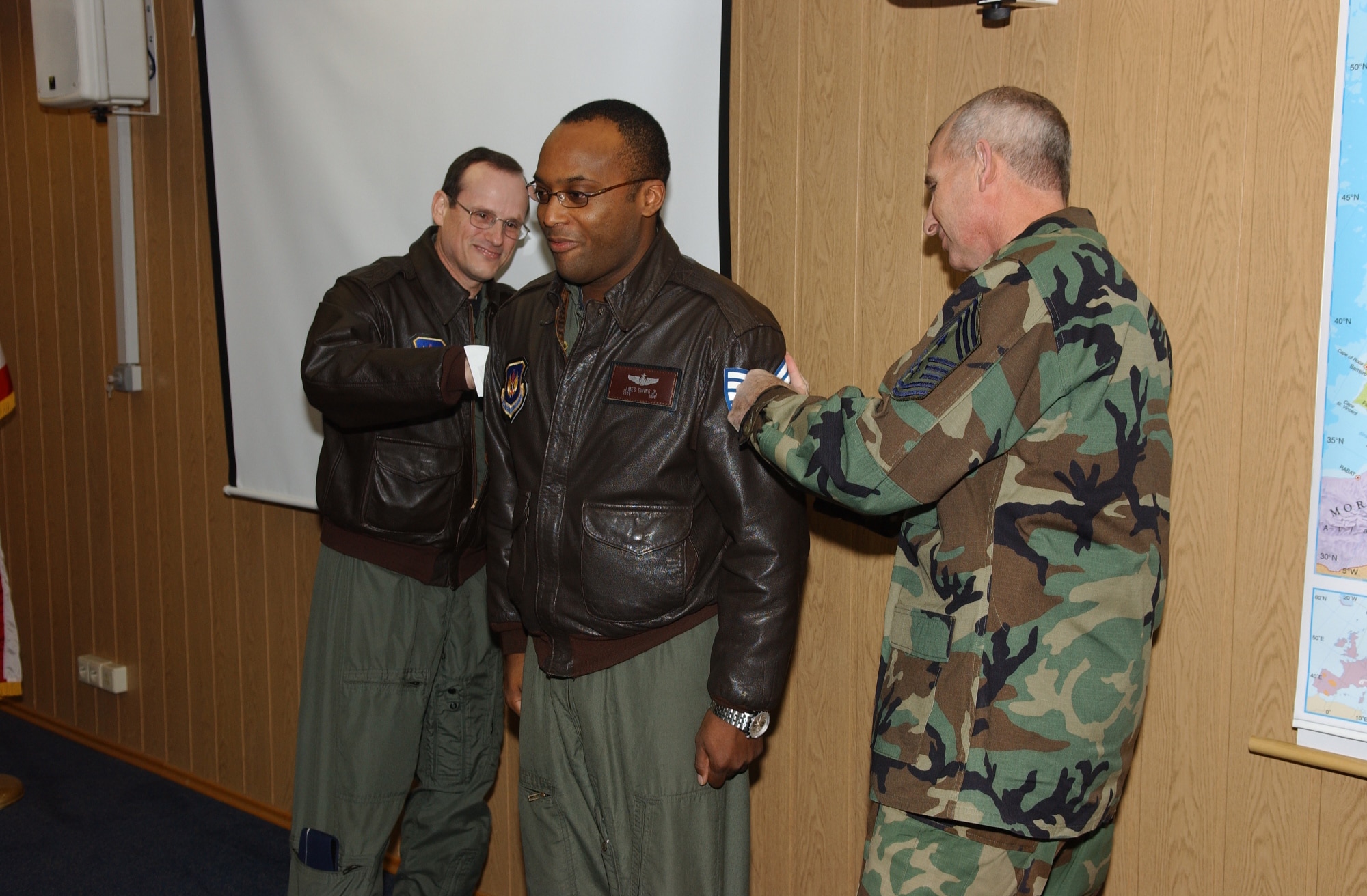 General Johnston and Chief Viel STEP promote Tech. Sgt. James Ewing from the rank of staff sergeant. Photo by Airman 1st Class Levi Riendeau
